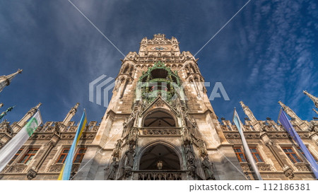 Clock Tower or Glockenspiel close-up, Detail of Rathaus New Town Hall with chime in city center timelapse, Munich, Germany. Clock Tower or Glockenspiel close-up, Detail of Rathaus New Town Hall with chime in city center timelapse, Munich, Germany. 112186381