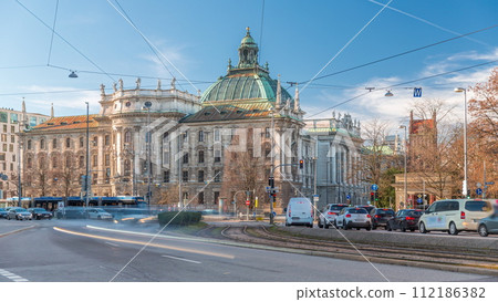 Exterior view of the Palace of Justice at the Karlsplatz timelapse in Munich, the capital of Bavaria, Germany. Exterior view of the Palace of Justice at the Karlsplatz timelapse in Munich, the capital of Bavaria, Germany. 112186382