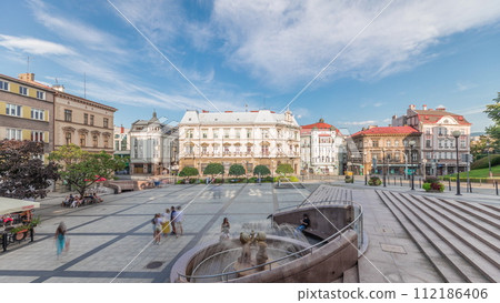 Panorama showing Sulkowski Castle and fountain on Chrobry Square in Bielsko-Biala timelapse, Poland. 112186406