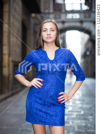 Elegant girl is posing in blue dress Elegant girl is posing in blue dress 112186425