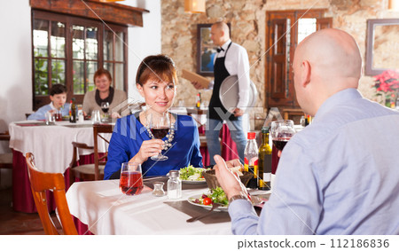 Adult couple at restaurant 112186836