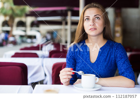 Young woman is dreaming in time breakfast 112187057