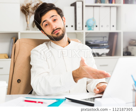 Office worker working at laptop Office worker working at laptop 112187305