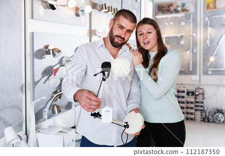 family buying table lamp family buying table lamp 112187350