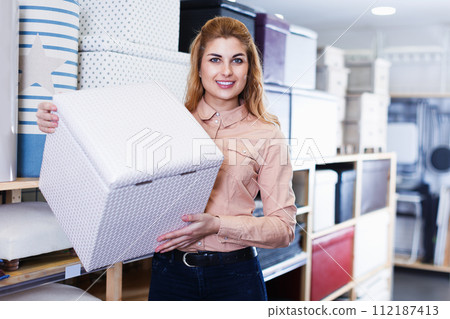 seller showing new comfortable ottoman 112187413