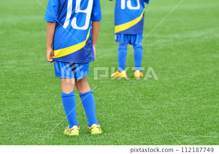 Youth soccer match on artificial turf Youth soccer match on artificial turf 112187749