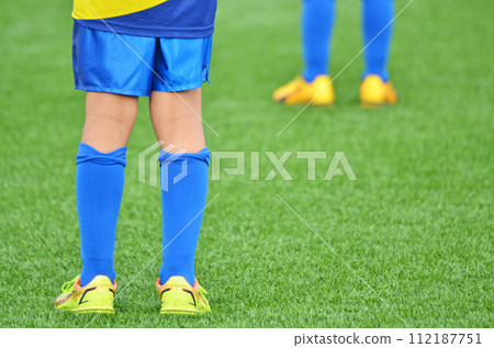 Youth soccer match on artificial turf Youth soccer match on artificial turf 112187751