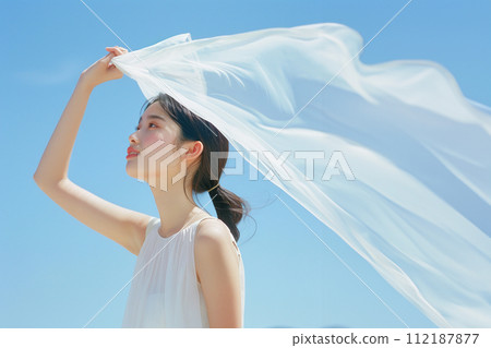 AI-generated image of a young woman standing holding a white cloth towards the sky 112187877