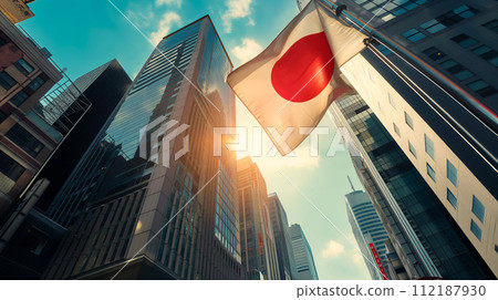 Japan national flag and government building with skyscrapers at sunset. Japan national flag and government building with skyscrapers at sunset. 112187930