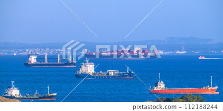 Yokohama cityscape in Japan View of container ships and jet ships in Tokyo Bay from Yokohama (Chiba in the back) 112188244