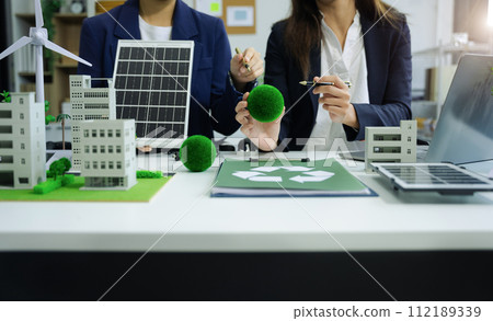Businessman working virtual modern computer to reduce CO2 emissions carbon footprint climate change to limit global warming.Sustainable development and innovation green business concept. 112189339