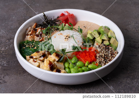 Delightful Poke Bowl with Fresh Ingredients and Vibrant Colors 112189810