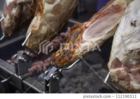 Detail of grilled roast meat, traditional food 112190311