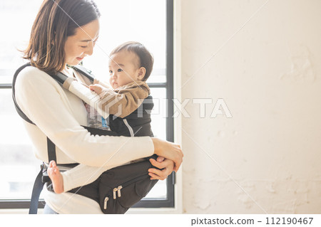 A mother holding a baby A mother holding a baby 112190467