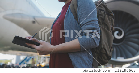 Happy attractive asian woman traveler with backpack at the modern airport terminal, copy space, Tourist journey trip concept Happy attractive asian woman traveler with backpack at the modern airport terminal, copy space, Tourist journey trip concept 112190663