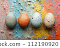 Group of colorful eggs on the table 112190920