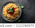 Plate of Pasta With Tomato Sauce and Basil 112190975