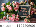 Happy Mothers Day Sign Next to Flowers 112190980