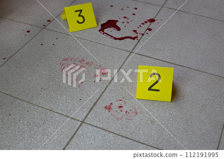 Evidence markers placed near traces of blood Evidence markers placed near traces of blood 112191995