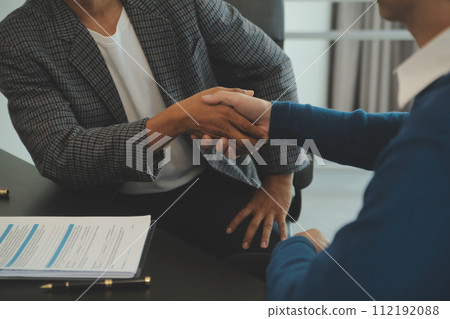 Team of architectures and businessmen discussing and brainstorming on floor plan modification for real estate investment and housing development project 112192088