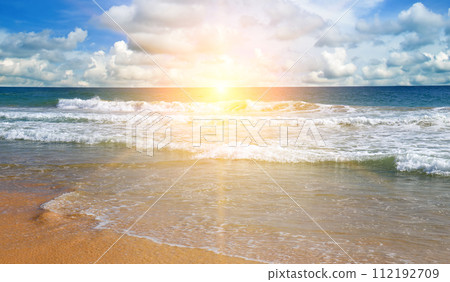 Bright sunrise over the tropical sea. Wide photo. 112192709
