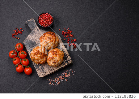 Delicious fresh fried minced fish cutlets with spices and herbs Delicious fresh fried minced fish cutlets with spices and herbs 112193826