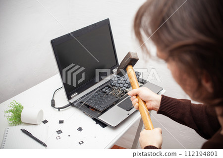 man office worker smashed a laptop, destroyed a computer. Anger, hatred, irritation. Error, brake, malfunction, does not want work. Bad emotions. depression, not preserved. Tired 112194801