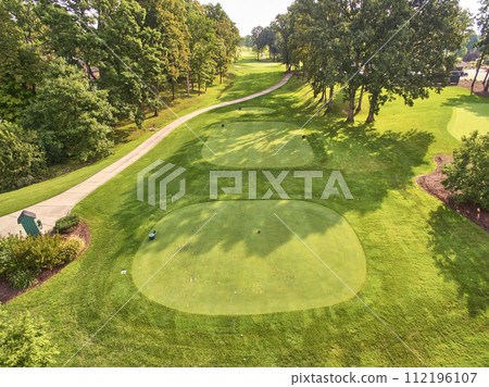 Aerial View of Serene Golf Course with Lush Fairways and Mature Trees 112196107