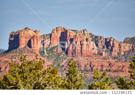 Sedona Red Rock Cliffs with Evergreen Frame, Clear Sky 112196135