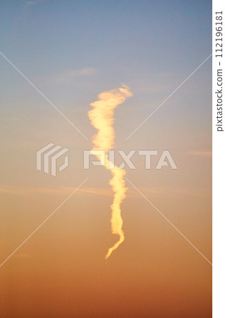 Golden Hour Contrail in Serene Sky Gradient Golden Hour Contrail in Serene Sky Gradient 112196181