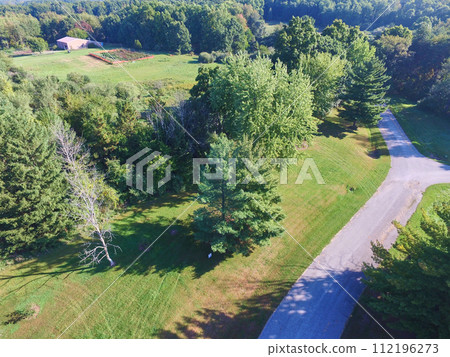 Aerial View of Serene Rural Landscape with Red Barn and Garden Path Aerial View of Serene Rural Landscape with Red Barn and Garden Path 112196273