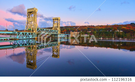 Aerial View of Portage Lake Lift Bridge at Sunrise with Autumn Foliage Aerial View of Portage Lake Lift Bridge at Sunrise with Autumn Foliage 112196316