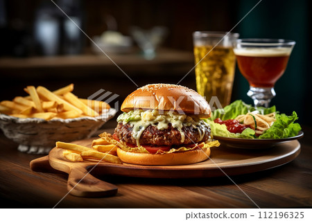 Double cheeseburger with lettuce blue cheese and tomatoes on a wooden board. Double cheeseburger with lettuce blue cheese and tomatoes on a wooden board. 112196325