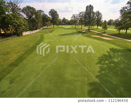 Aerial Sunny Golf Course with Mature Trees and Sand Bunkers Aerial Sunny Golf Course with Mature Trees and Sand Bunkers 112196438