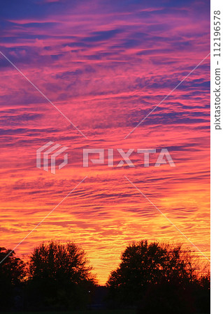 Vibrant Sunset Silhouettes with Dramatic Sky in Fort Wayne Vibrant Sunset Silhouettes with Dramatic Sky in Fort Wayne 112196578