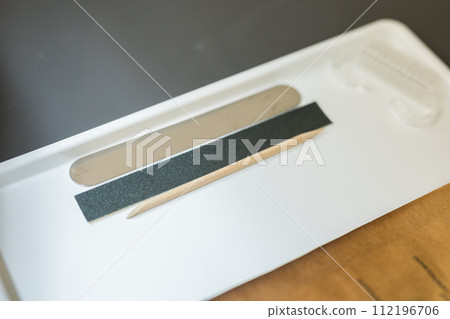 Nail file indoors background. Concept of polishing nails. Spa treatment beauty. 112196706