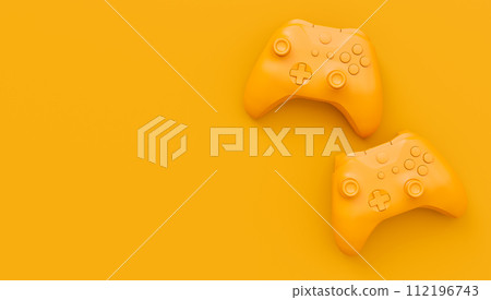 Video game joysticks or gamepads in plain monochrome yellow color background Video game joysticks or gamepads in plain monochrome yellow color background 112196743