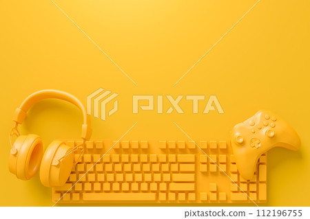 Modern home office setup featuring keyboard, gaming controllers and headphones Modern home office setup featuring keyboard, gaming controllers and headphones 112196755