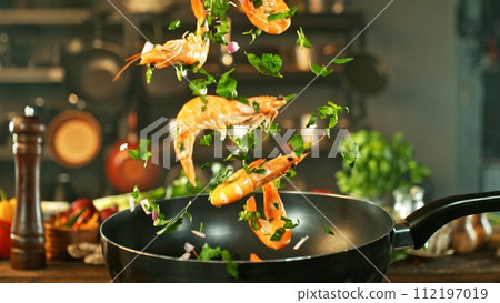 Freeze Motion of Wok Pan with Flying Prawns in the Air. 112197019