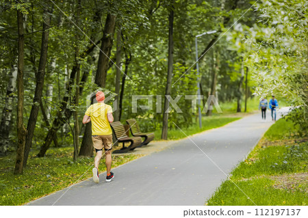 Athletic young man running in nature, rear view. Healthy lifestyle 112197137