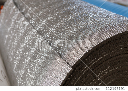 Insulation material in roll for sale on a store warehouse. 112197191