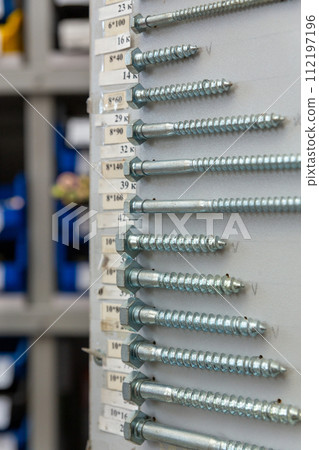 An assortment of screws with sizes and prices 112197196