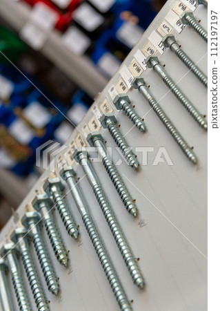 An assortment of screws with sizes and prices An assortment of screws with sizes and prices 112197197