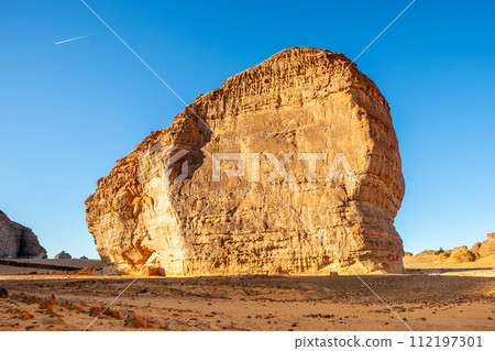 Sandstone rock erosion monolith standing in the desert, Al Ula, Saudi Arabia 112197301