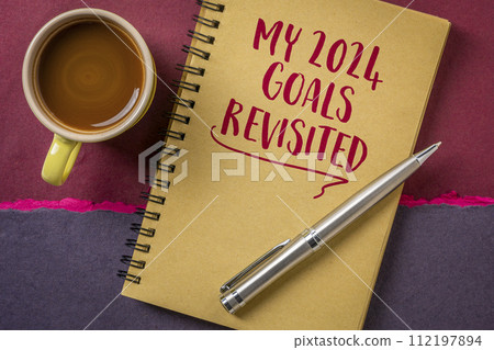 my 2024 goals revisited, handwriting in a spiral notebook, goal setting concept my 2024 goals revisited, handwriting in a spiral notebook, goal setting concept 112197894
