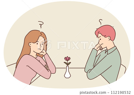 Unhappy man and woman at table in cafe 112198532