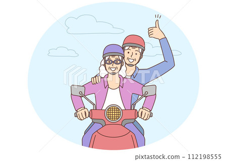 Smiling mature couple driving motorbike 112198555