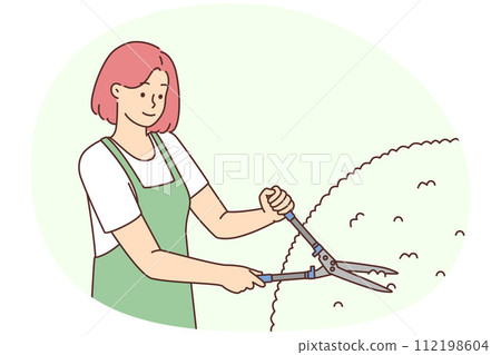 Female gardener cutting bushes 112198604