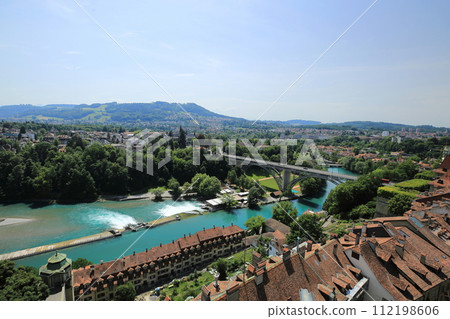 View of the summer sky, the medieval old town and the Aare River from Bern Cathedral (Canton of Bern, Switzerland) 112198606