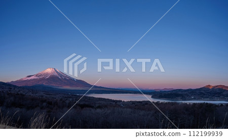 Panoramic view of Mt. Fuji and Lake Yamanaka bathed in the morning glow seen from the observation deck 112199939